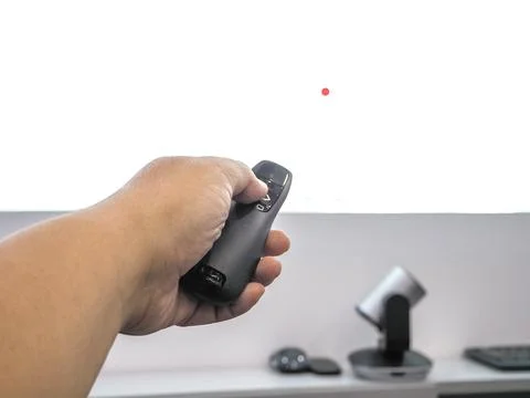 Close up hand holding a remote control slide presentation Stock Photos