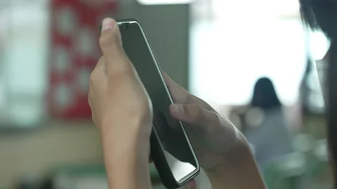 Close up hand holding smart phone for use searching data to learning in class 库存影片 217385497