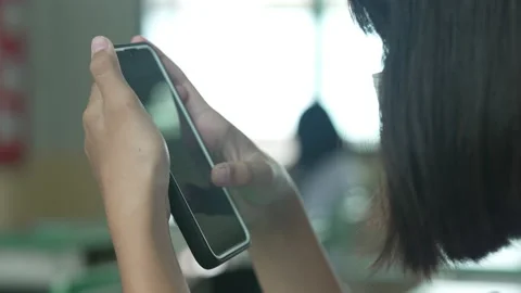 Close up hand holding smart phone for use searching data to learning in class 動画素材 217386468