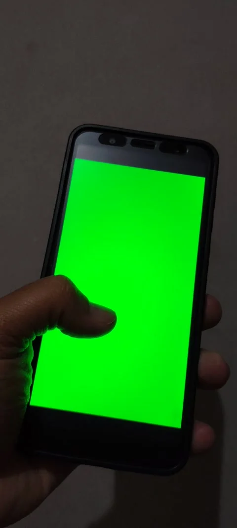 Close up of a hand holding a smartphone with a green screen. Stock Footage 341906272