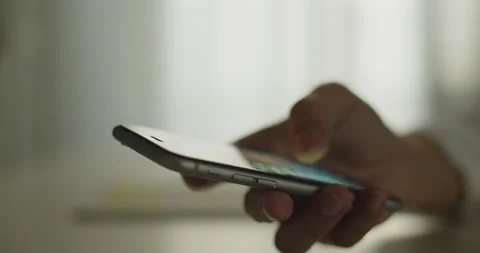 Close Up hand holding a smartphone scrolling through social media. Stock Footage 155962762