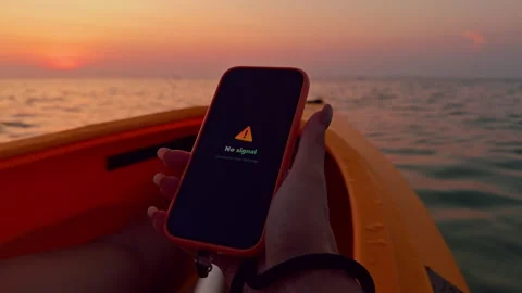 Close Up Hand Holding Smartphone Showing No Signal Message While Sitting in Kaya Stock Footage 329641268