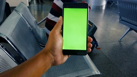 Close up hand holding using mobile smart phone green screen Stock Footage 108306745