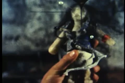 Close-up of hand holding voodoo doll Stock Footage 11354857