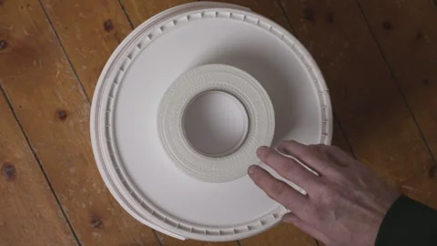 Close up of hand hovering over fiberglass mesh tape roll Stock Footage 327143517