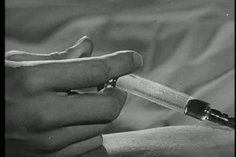 Close-up of hand  injecting needle into arm Stock Footage 11353690