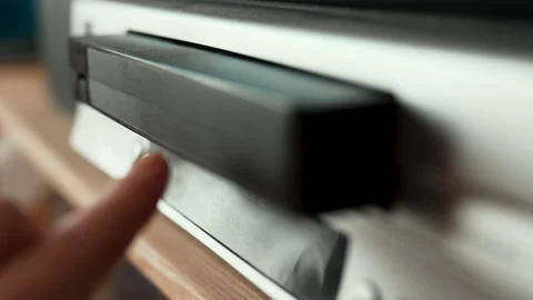 Close up of a hand inserting a VHS video cassette into a vintage VCR player, 4K  Video stock 330677842