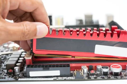 Close up hand install high performance  DDR3 ram to ram slot Stock Photos