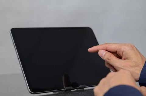 Close-up of Hand Interacting with Blank Digital Tablet Screen Stock Photos