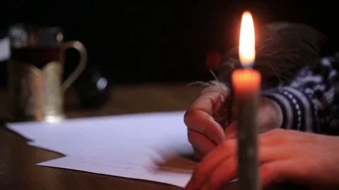 Close-up of a hand as it writes a letter on a paper. Stock Footage 72163186