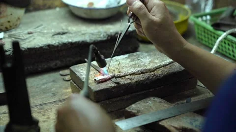 Close-up of a hand of a Jewelry technician who builds a precious jewel Stock Footage