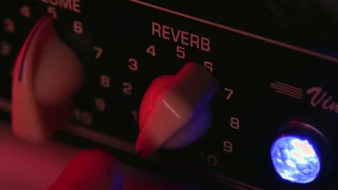 Close up of Hand Keep Moving Reverb of Guitar Amplifier 動画素材 123858628