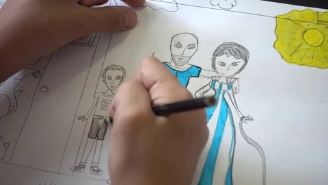Close-up Hand kid drawing with pencil on a Paper her Family Stock Footage 77209814