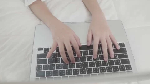 Close up hand kid girl using laptop lies on bed. Stock-Footage 240800248