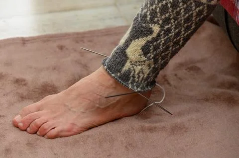 Close-up of a hand-knitted stocking in progress on a human foot Stock Photos