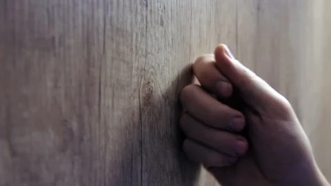 Close-up of hand knocking on door 스톡 동영상 120444545