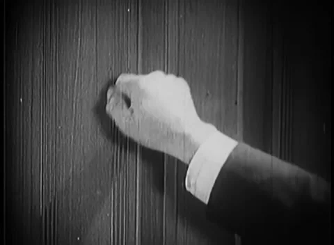 Close-up of hand knocking on door Stock Footage 260250356