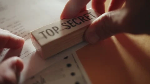 Close up - hand labels official document with red rubber stamp of Top Secret Stock Footage 242426993