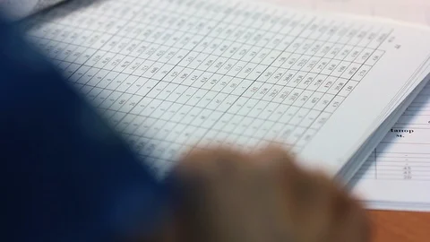 Close-up hand leafing through the document. Stock Footage 103646499