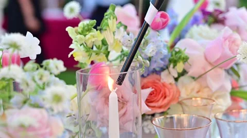 Close-up of hand with lighter lighting a white candle Stock Footage 269337695