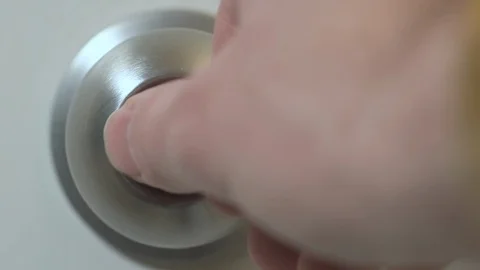 Close up of hand locking a privacy doorknob Stock Footage 101217265