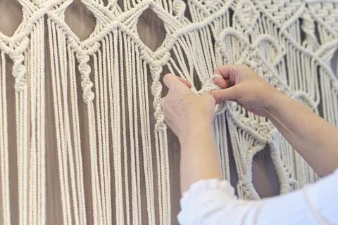 Close-up of hand made macrame texture pattern. ECO friendly modern knitting Stockfoto's