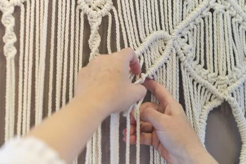 Close-up of hand made macrame texture pattern. ECO friendly modern knitting Foto stock