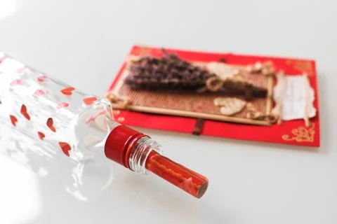 Close-up of a hand-made post card with copy space and bottle Stock Photos