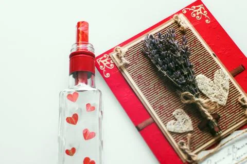 Close-up of a hand-made post card with copy space and bottle Stock Photos