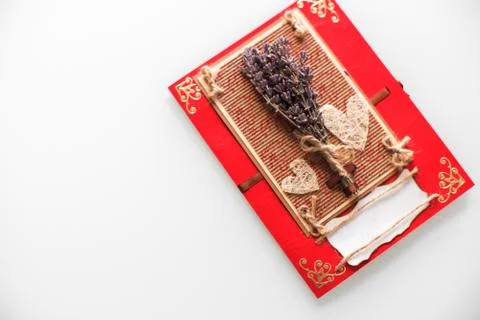 Close-up of a hand-made post card with lavender, hearts and copy space Stock Photos