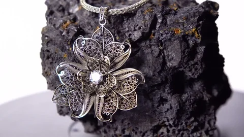 Close up of hand made of silver necklace, rotation 360 Stock Footage 93814167