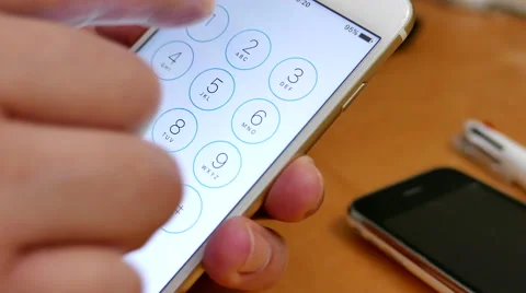 Close up hand making a phone call on iphone Stock Footage 57886607