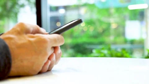 Close-up of hand males looking at smartphone. Stock Footage 284297099