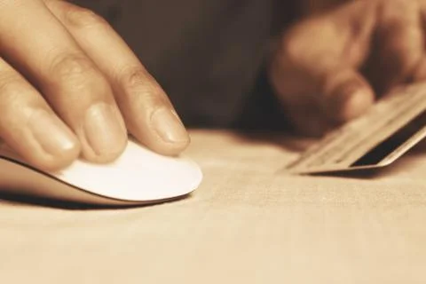 Close up hand man click mouse with doing finance online banking. Stock Photos