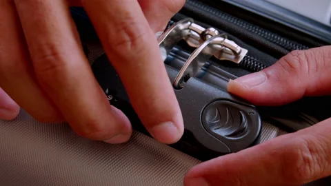 Close up hand man close suitcase with combination lock. Stock Footage 197015501
