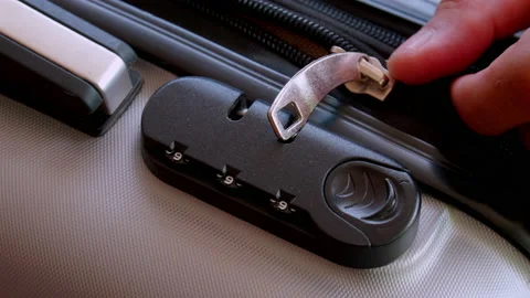 Close up hand man close suitcase with combination lock. Stock Footage 197015742