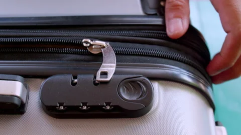 Close up hand man close suitcase with combination lock. Stock Footage 197015981