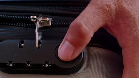 Close up hand man close suitcase with combination lock. Stock Footage 197016361