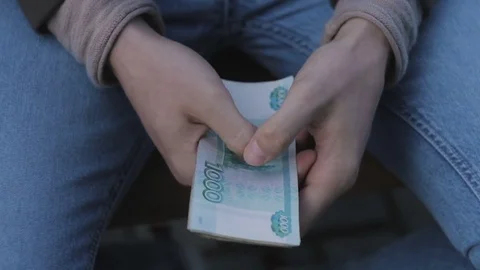 Close-up of the hand of a man counting banknotes, rubles Stock Footage 79667738