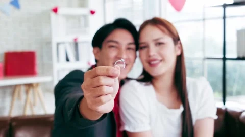 Close-up hand of the man holding the ring in front of the camera Stock Footage 327190565