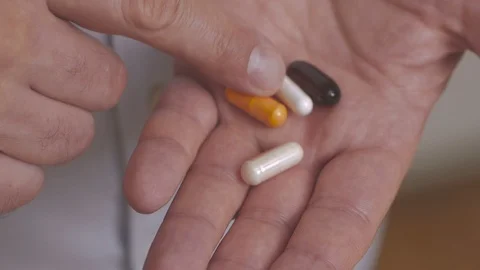 Close up of the hand of a man holding a tablet in his palms. A man takes one Stock Footage 101087188