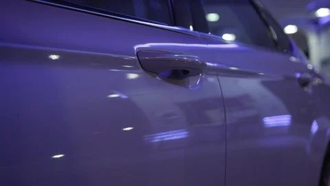 Close up hand man open door car on drivers side city lights at night on the Stock Footage 111602256