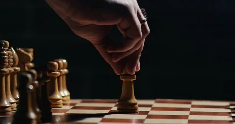 Close up of the hand of a man playing chess Stock Footage 131084473