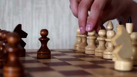 Close-up of the hand of a man playing chess, making move by pawn in a chess Video stock 236459888