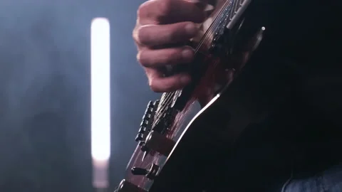 Close up hand of man playing electric guitar on stage. rock star professionally Stock Footage 139662758