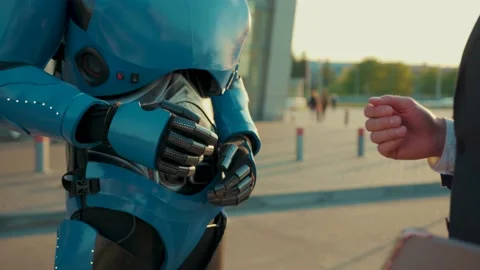 Close up hand of a man shaking hands with a robot human interaction with Video stock 133300096