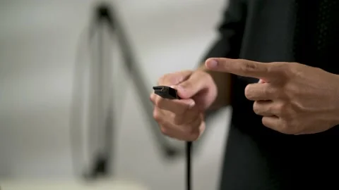 Close-up hand of man showing a usb cable plug Video stock 156023864