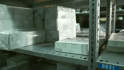 Close up hand of Man takes box from shelf inside warehouse Stock Footage 76500871