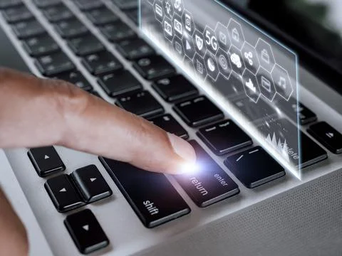 Close up hand man touch enter on laptop keyboard with hologram screen connect 스톡 사진