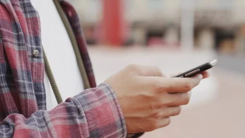 Close-up of hand man tourist using  smart phone on blurred background. Stock Footage 118836785